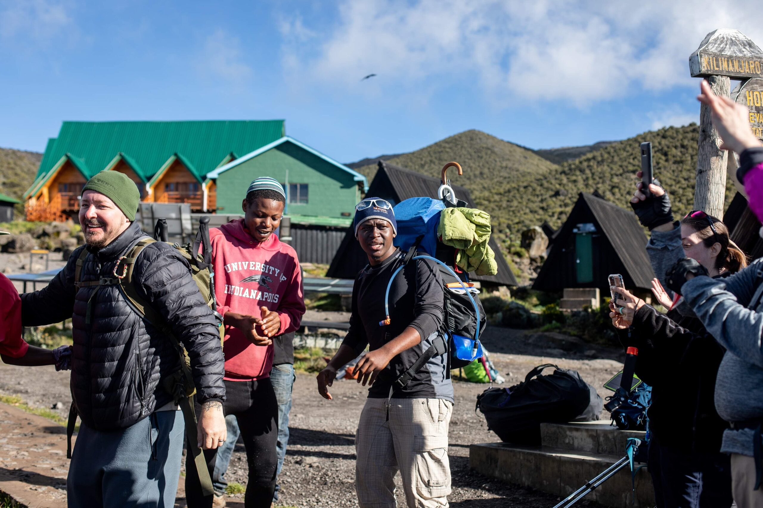 tour guides and tourist preparing to climb mount kilimanjaro