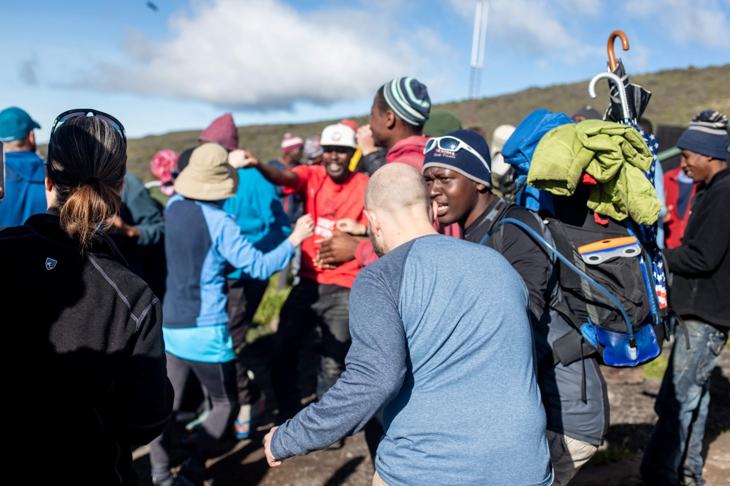 Tourists and local guides at the gate of kilimanjaro mountain